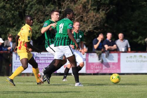 Enfields Junior Mubiayi (L) is crowded out by the defence but the ball runs to Ryan Blackman for the final goal
