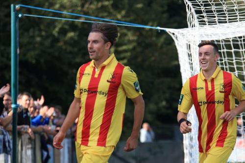 Sam Youngs (L) celebrates his second goal, Enfields fifth, with Brandon Adams