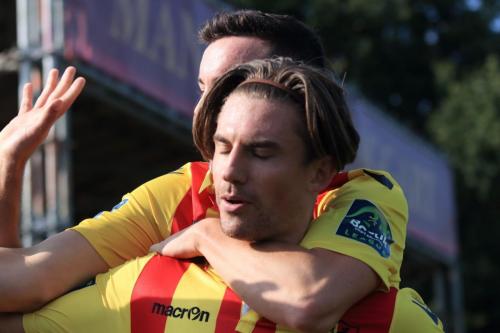 Sam Youngs (front) celebrates his second goal, Enfields fifth, with Brandon Adams