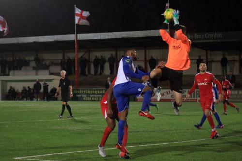 Carshalton keeper Patrick Ohman catches the ball ahead of Taofiq Olomowewe