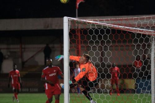 Carshalton keeper Patrick Ohman deals with an awkward cross