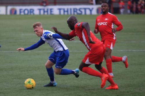 Enfields Ryan Blackman and Carshaltons Peter Adeniyi and Michael Aziaya (R)