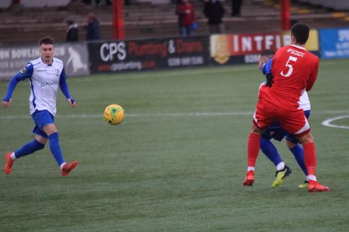 Enfields Sam Chaney (L) and Billy Bricknell and Carshaltons Danny Dudley