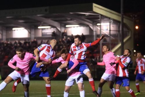 Dorkings Sami El-Abd (stripes, L) and Niall McManus challenge Dan Rumens (L) and Marc Weatherstone