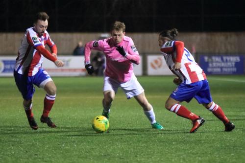 Enfields Aaron Greene and Dorkings Niall McManus (L) and Jerry OSullivan