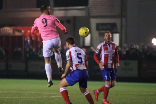 Enfields Billy Bricknell (L) and Dorkings David Ray (5) and Lewis Taylor
