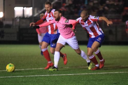 Enfields Billy Bricknell and Dorkings Lewis Taylor (L) and Sami El-Abd