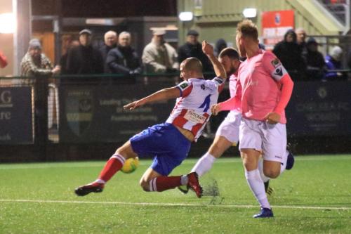 Enfields Billy Bricknell shoots narrowly wide as Sami El-Abd tries to block