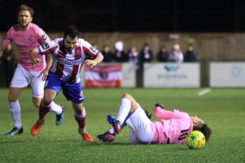 Enfields Sam Youngs (R) is brought down by Matt Briggs