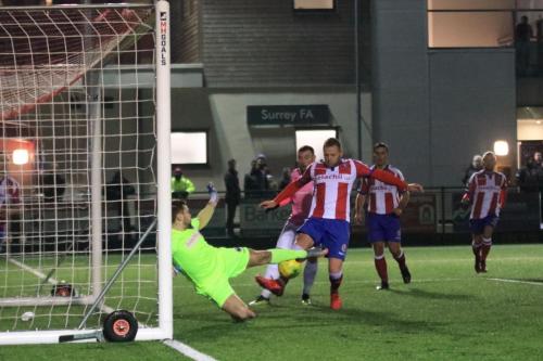 With keeper Slavomir Huk beaten and Enfields Billy Bricknell lurking, Dorkings Lewis Taylor clears off the line