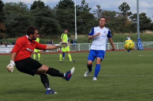 Bedford keeper Kyle Forster clears from Liam Hope