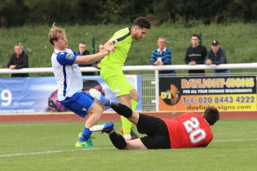 Bedford keeper Kyle Forster smothers the ball ahead of teammate Brett Longden and Enfields Aaron Greene (L)