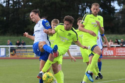 Bedfords Brett Longden challenges Sam Youngs (L)