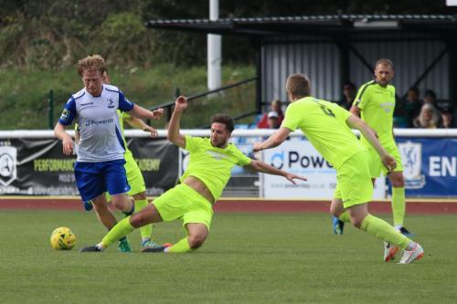 Bedfords Brett Longden tackles Aaron Greene (L)