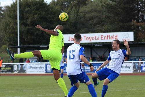 Bedfords Gavin Hoyte heads clear from Brandon Adams (15) and Liam Hope