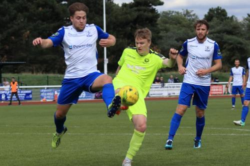 Bedfords Mason Watkins-Clark (yellow) clears from Lewis Taaffe