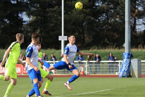 Enfields Brandon Adams (R) heads over the bar