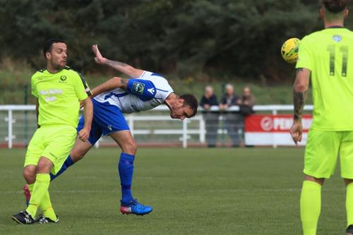Enfields Matt Johnson (white) beats Callum Donnelly to a header