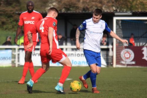 Carshaltons Luke Read (4) and Peter Adeniyi and Enfields Sam Chaney