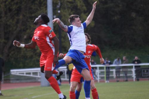 Carshaltons Paris Hamilton-Downes (L) heads clear from Josh Davison