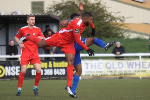 Carshaltons Taofiq Olomowewe and Luke Read (L) and Enfields Kezie Ibe
