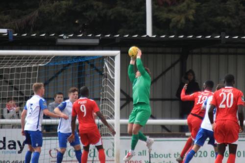 Enfield keeper Joe Wright collects a cross