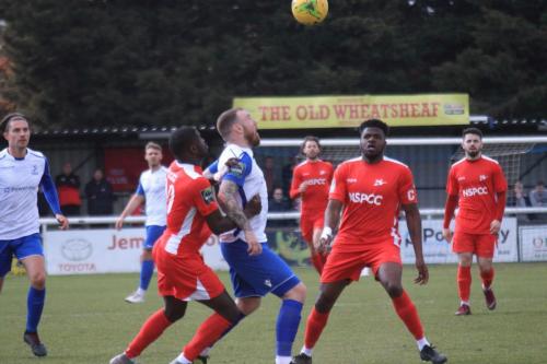 Enfields Billy Bricknell and Carshaltons Jacob Mendy (L) and Paris Hamilton-Downes