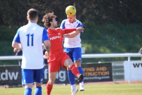 Enfields Dan Rumens (R) heads clear from Harry Ottaway
