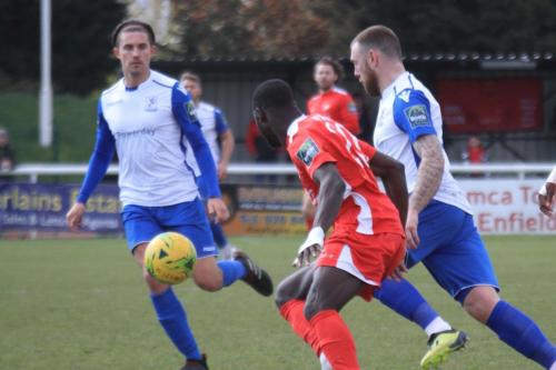 Enfields Sam Youngs (L) and Billy Bricknell and Carshaltons Jacob Mendy
