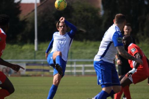 Enfields Sam Youngs chips the ball forward
