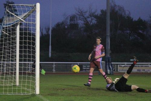 Casuals Jack Strange and keeper Daniel Bracken watch anxiously as an Enfield shot hits the post and bounces to safety