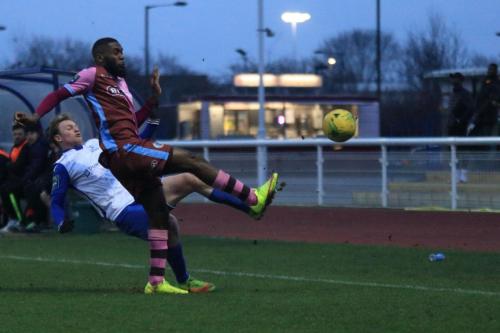 Casuals Juevan Spencer (R) clears from Aaron Greene