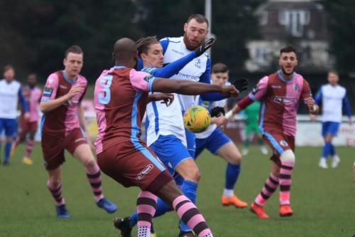 Enfields Sam Youngs (white, L ) and Billy Bricknell and Casuals Hakeem Adelakun