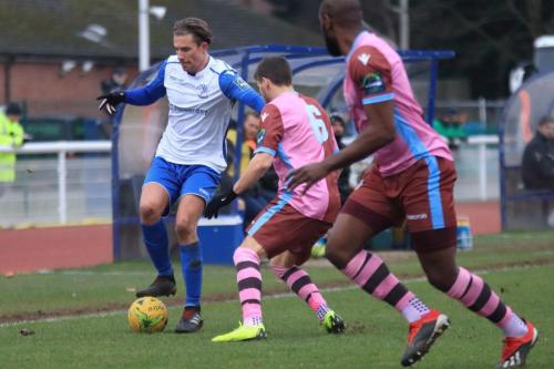 Enfields Sam Youngs and Casuals Majed Osman (6) and Hakeem Adelakun