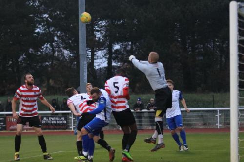 Kingstonian keeper Rob Tolfrey punches clear