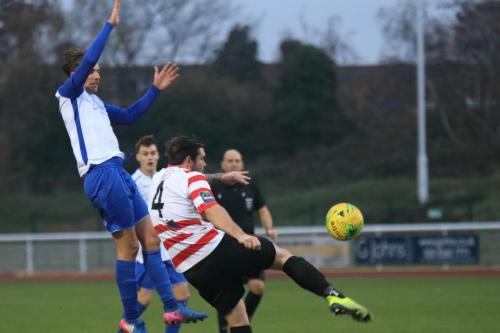 Kingstonians Aaron Lamont (4) clears from Sam Youngs