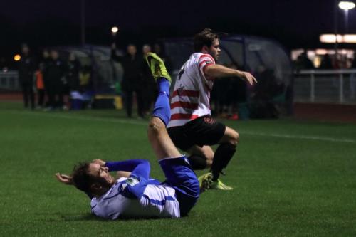 Kingstonians Aaron Lamont (R) tackles Matt Johnson