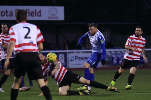 Kingstonians Jay Gasson slides in to block Billy Bricknells shot