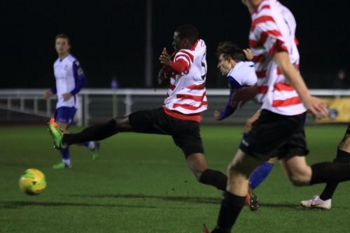 Kingstonians Temi Eweka (5) stretches in an attempt to block Sam Youngs shot