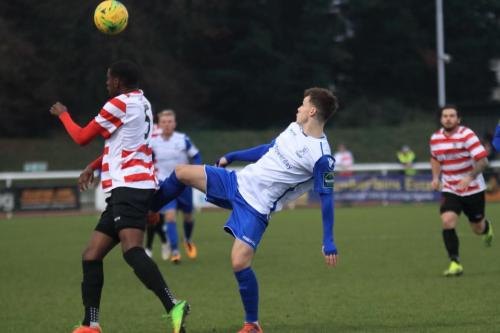 Kingstonians Temi Eweka (L) and Enfields Sam Chaney