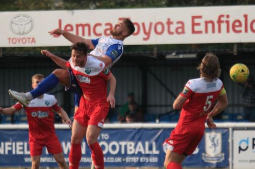 Enfields Dan Rumens (white) challenges Craig McGee