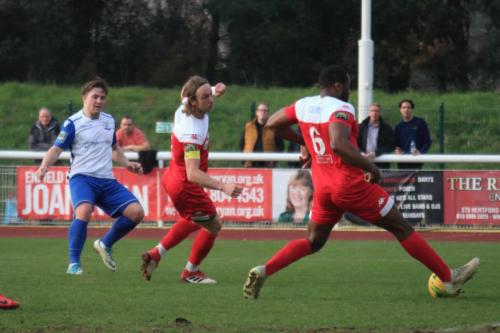 Enfields Lewis Taaffe (L) beats Will Salmon but not Jerry Nnamani (6)