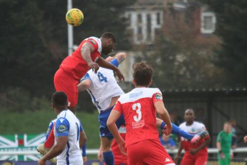 Leatherheads Jerry Nnamani (red, L) challenges Matt Johnson