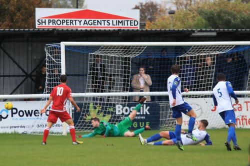 Enfield keeper Matt Nolan pushes a shot past the post