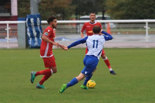 Enfields Aaron Greene (11) runs past Harry Osborne