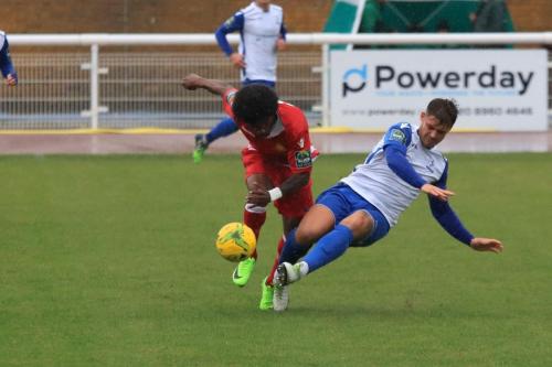 Enfields Dan Rumens (R) challenges Walter Figueira