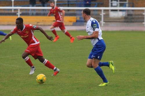 Enfields Matt Johnson (R) breaks from defence as Kershaney Samuels moves to cover