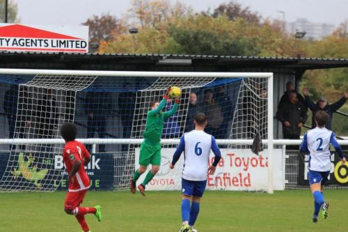 Enfields Matt Nolan catches an attempted lob from Walter Figueira (9)