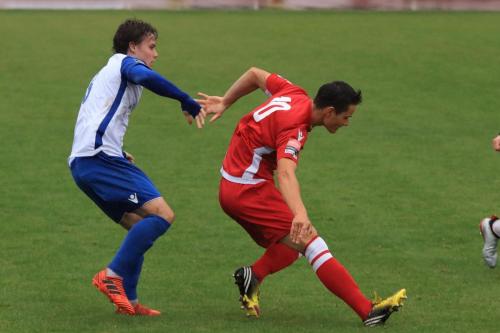Enfields Sam Chaney (L) and Mersthams Fabio Saraiva