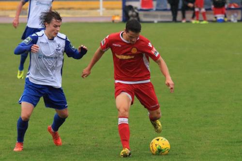 Enfields Sam Chaney (L) and Mersthams Fabio Saraivax